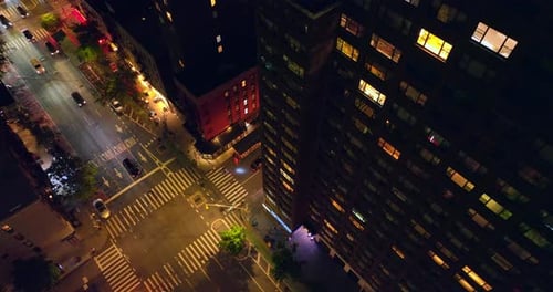 Busy New York roads at night. Lively streets of vibrant metropolis from aerial perspective.