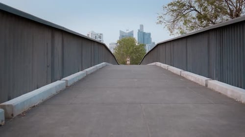 Young fitness woman in sportswear jogging in city park