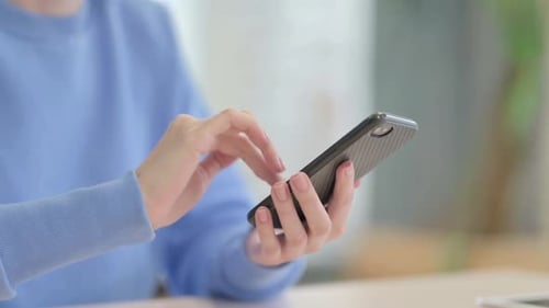 Close up of Woman Browsing Internet on Smartphone