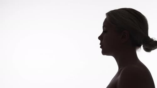 Silhouette of Woman Opening and Closing Mouth