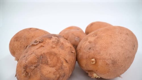 Potatoes close up on white background isolated 4K