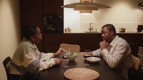 Couple Enjoying a Quiet Dinner with Wine at Home