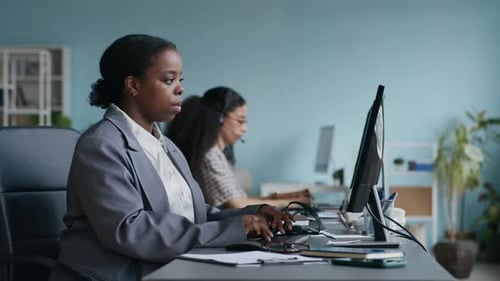 Young Operator Networking, Then Taking Headset and Putting It on Her Head