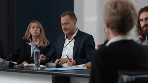 Panel of professionals discussing a topic at conference