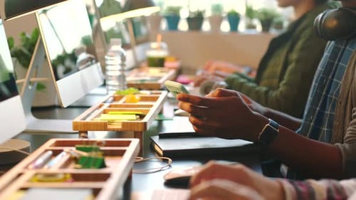 Business people typing on their keyboard at table in office doing research for startup company
