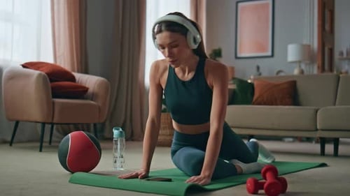 Young Woman Does Floor Exercises at Home