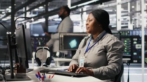 Data Center Computer Scientist Using PC to Monitor Artificial Intelligence