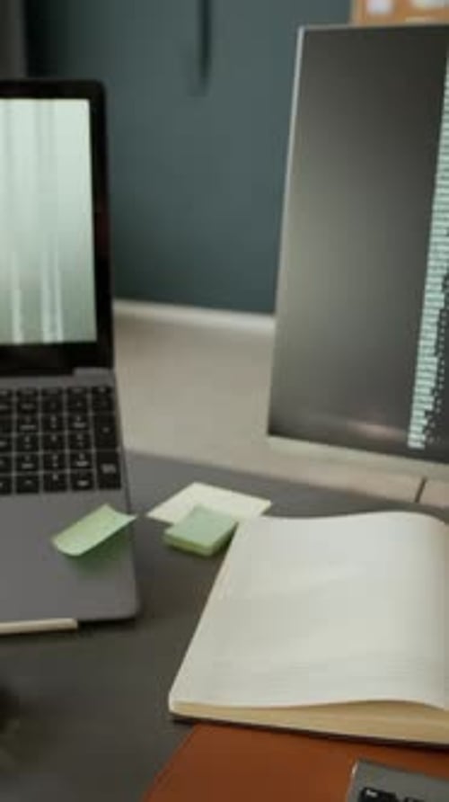 Vertical POV of Programmer Coding in Modern Office