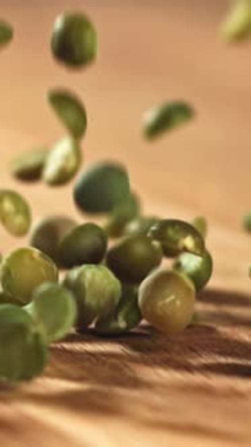 Green Peas Fall on the Table Filmed on a Highspeed Camera at 1000 Fps
