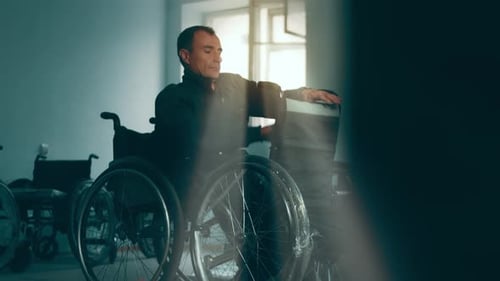 A Disabled Man Assembles a Stroller