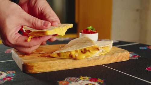 Close Up of Cheese Quesadilla Eating Traditional Mexican Food Tex Mex Cuisine