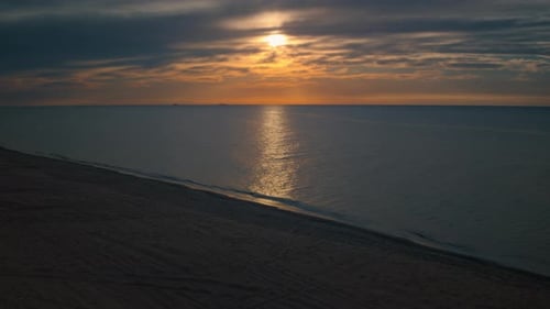 Aerial View Sea Beach At Golden Sunset. Sun Reflection On Lake Water Surface. Drone Shot Seashore...