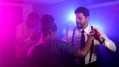 Stylish People Dancing at Nightclub Celebration