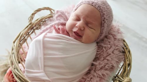 Sweet Newborn Baby Sleeping Peacefully in Basket