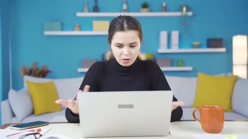 Young entrepreneur woman working in home office having problems.