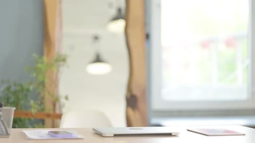 Businessman Coming to Office and Starting Work on Laptop