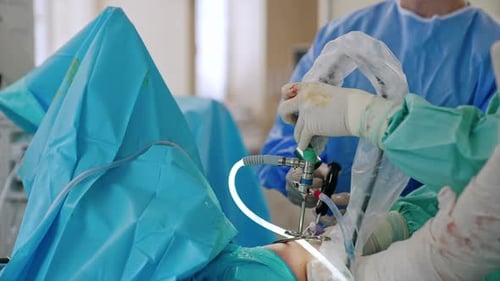 Medical Professionals Performing Surgery in Operating Room
