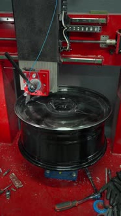 Automated Machine for Manufacturing Car Rims at the Factory Concept of Automobile Production