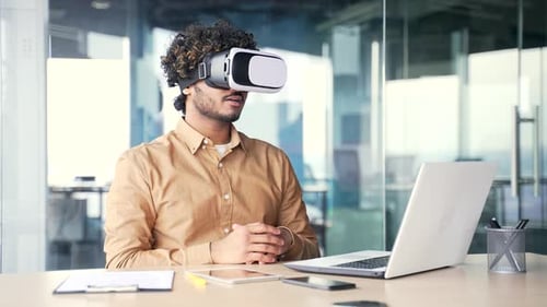 Man Wearing VR Headset in Modern Office