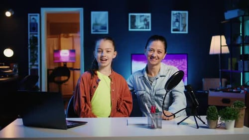 Daughter and Mother Filming Video for Newly Opened Family Channel