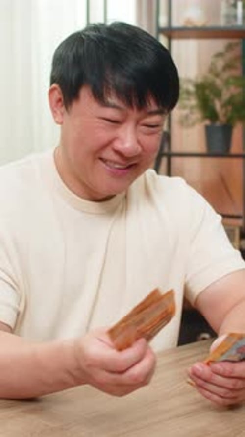 Asian Man Counting Happily Money Euro Cash Pleased with Earned Income Celebrates Big Financial Gain