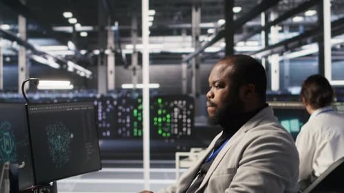 Exhausted Server Farm Employee Stretching Back