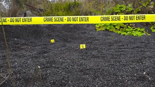 Crime Scene Tape Blocking Entry with Evidence Markers