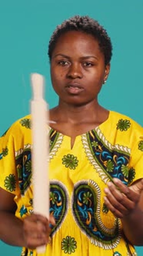Young Adult Woman with Rolling Pin Posing Indoors