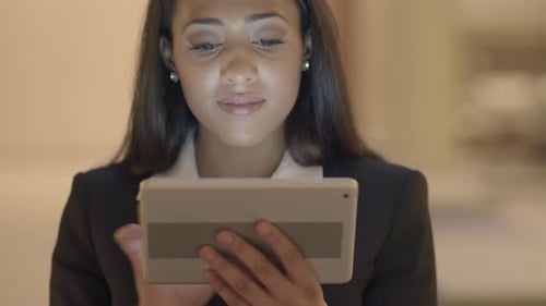 Woman Using Tablet Close Up in Workplace