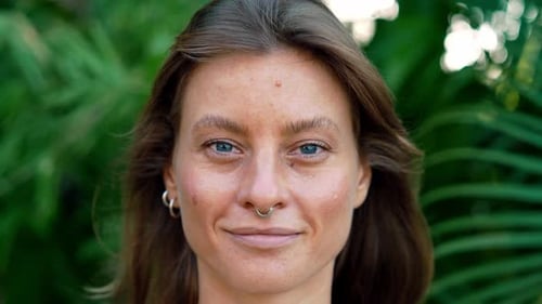 Happy Portrait of Beautiful Woman at Green Nature Looking at Camera and Smiling