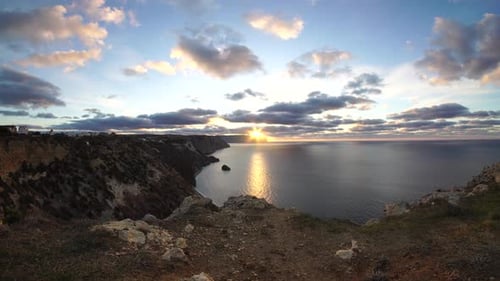 Sea Landscape with Rocky Coastline on Sunset Time with Cloudy Sky