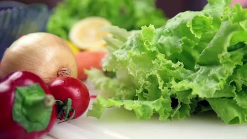 Hands Slice Green Lettuce for Healthy Salad