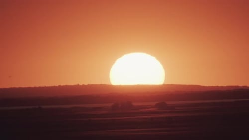 Big Sun at Sunset Without Clouds