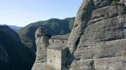 ancient castle in a mountain near Genova, Liguria, Italy. drone passing close to the building