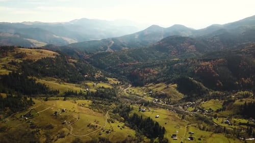 Aerial View of Autumn Mountain Landscape with Evergreen Pine Trees and Yellow Fall Forest with