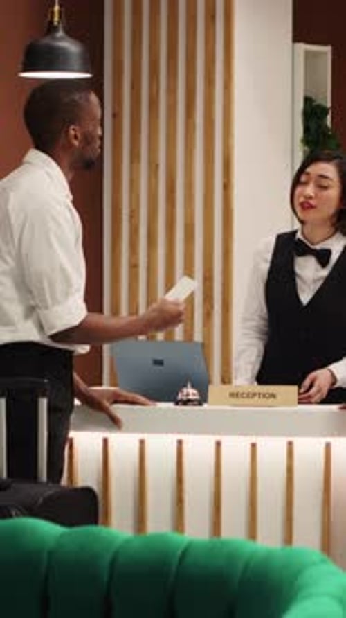 Vertical Video Hotel Staff Assisting Weary Tourists
