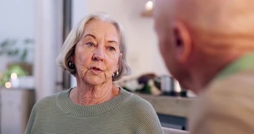 Senior Woman Smiling and Talking Indoors