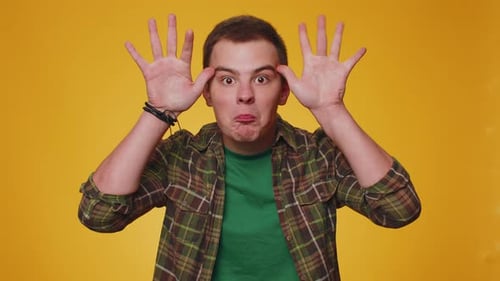 Funny Joyful Man Making Playful Silly Facial Expressions Grimacing Fooling Around Showing Tongue