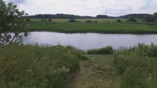 Wooden Boat In A Winding River. Aerial Low Dolly-Out Shot