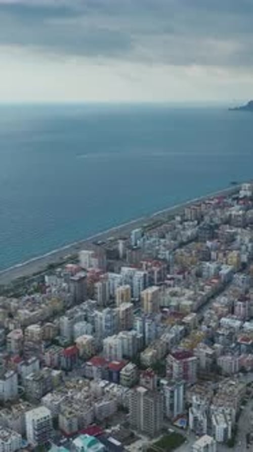 Vertical Video Scenic Aerial Perspective of a Small Town on the Mediterranean Coast With Urban and