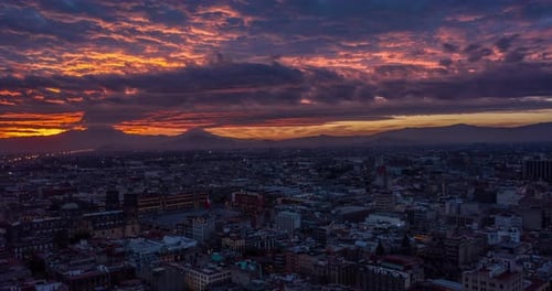 Aerial hyperlapse of colorful sunrise in historical center with the Zocalo main square the Mexican f