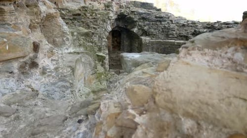Ancient Basingwerk abbey abandoned historical landmark building stone walls left close up dolly