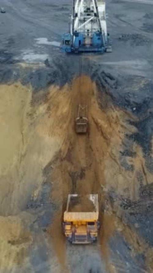 Heavy Machinery is Engaged in Digging Operations at the Construction Site Including Excavation Stock