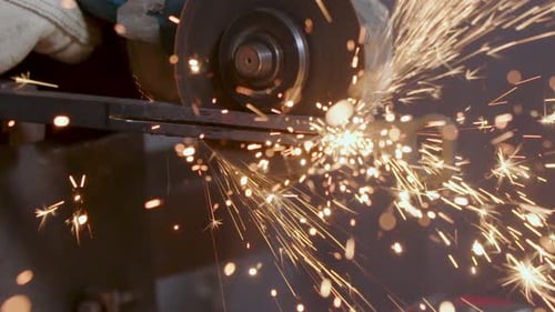 Blacksmith Cutting Steel Metal With Saw Grinder