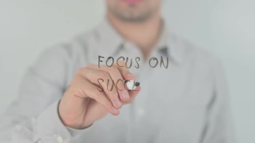 Writing Focus On Success with Marker on Glass