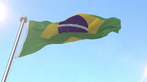 Brazil National Flag Waving Realistically in Blue Sky