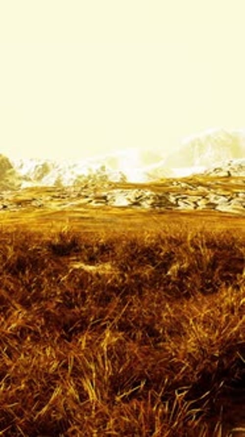Grassy Field With Majestic Mountains