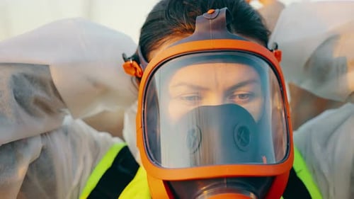 Person Adjusting Protective Gear in Close-Up Shot