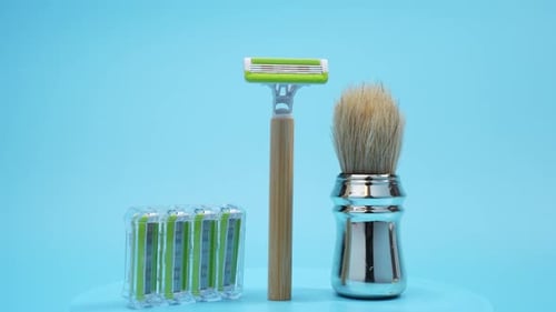Shaving set with brush and replacement shaving blades.
