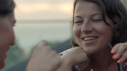 Happy, Pretty Girlfriends Talking and Drinking Cocktails in Cafe Adult